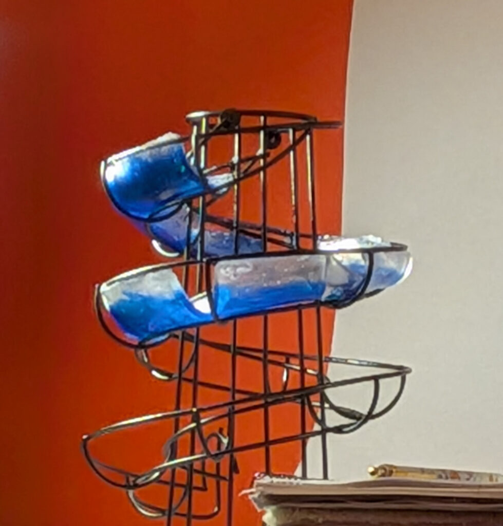 Upcycled lamp with metal frame and epoxy. Work in progress.
