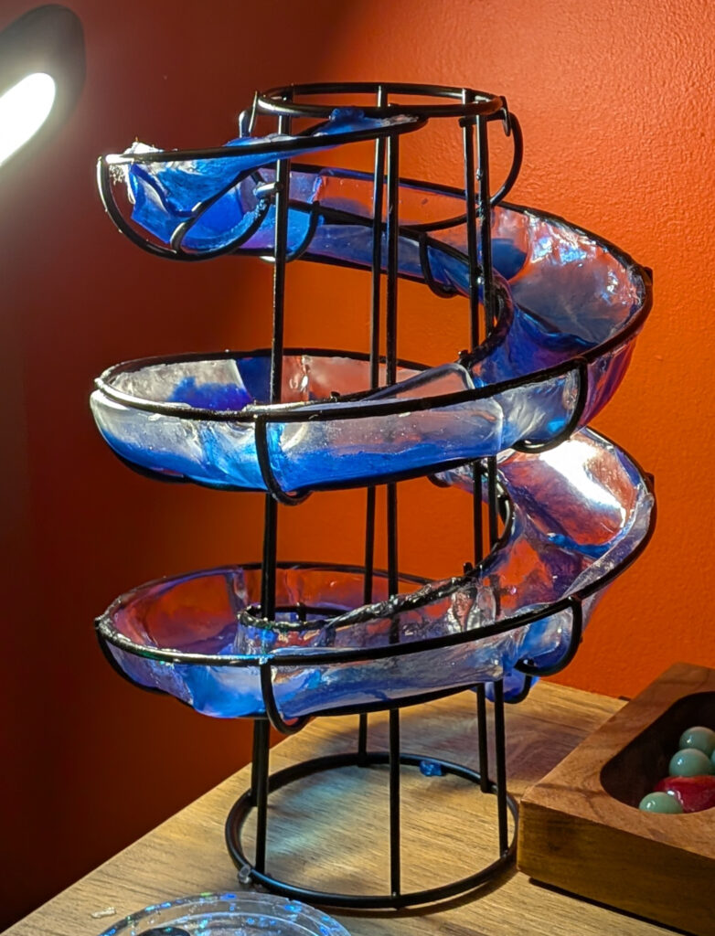 Upcycled lamp with wire frame filled with epoxy, work in progress.